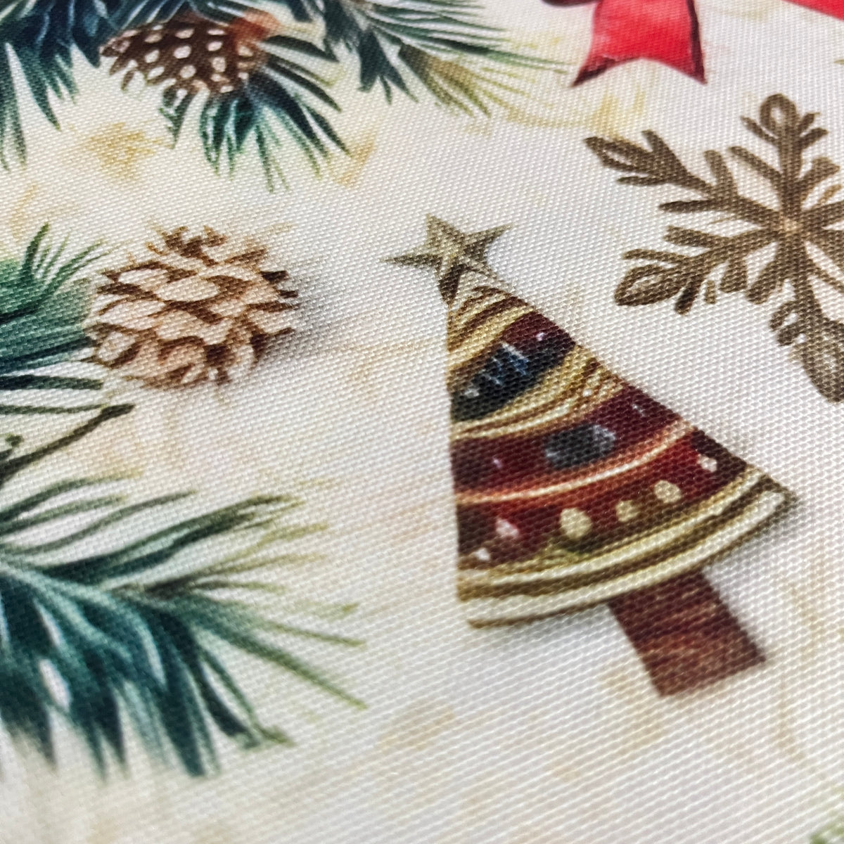 Toile déperlante de Noël poinsettias et branches de sapin, tissu au mètre plié - MyTissus
